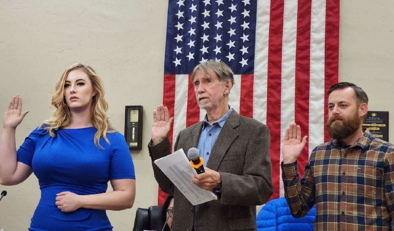 Trinity Burruss, Kim Douglass and Sean Lomen being sworn in